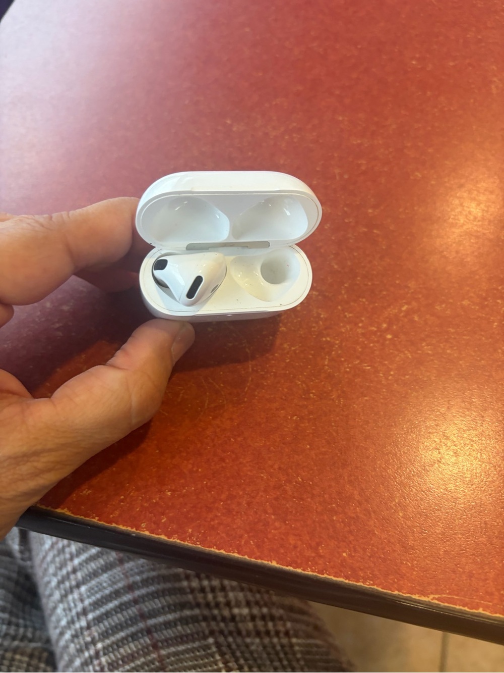 Apple White Wireless Earbuds with Charging Case - Single Earbud Shown